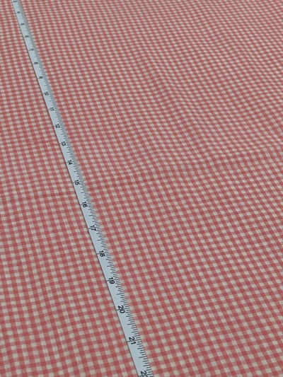 Peach and white plain gingham checks yarn-dyed fabric.