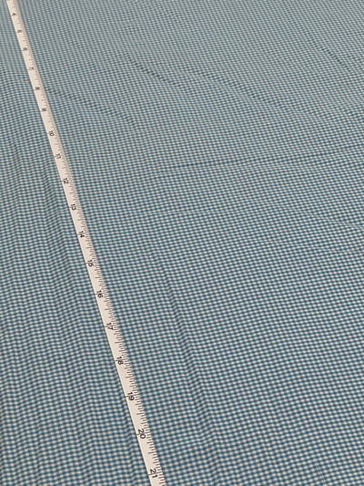Blue, white and purple plain gingham checks yarn-dyed fabric with small, even checks.