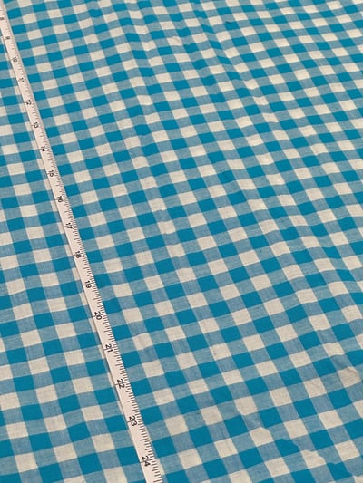 Turquoise and white plain gingham checks yarn-dyed fabric.