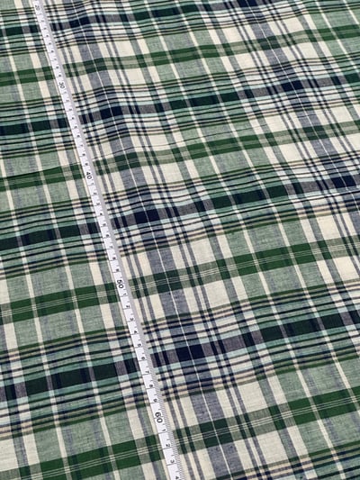 Green, navy and off-white plaid yarn-dyed fabric, with thin beige lines.