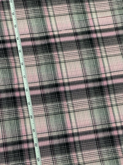Black and pink plaid yarn-dyed fabric with lurex, with crossing bands of different widths.