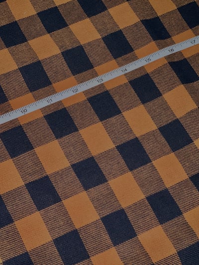 Navy and mustard buffalo check yarn-dyed fabric.