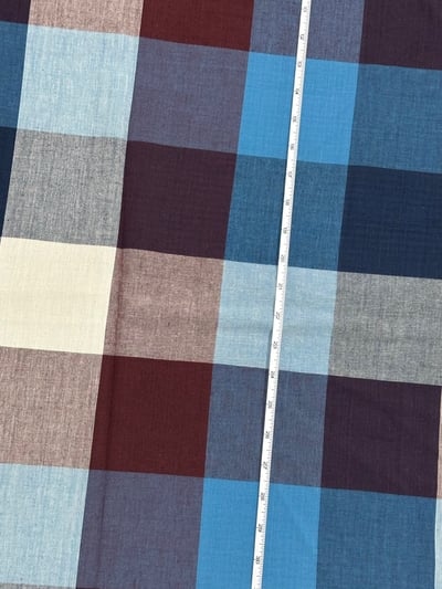 Blue, maroon and white tom tom check yarn-dyed fabric, with navy and grey blocks.