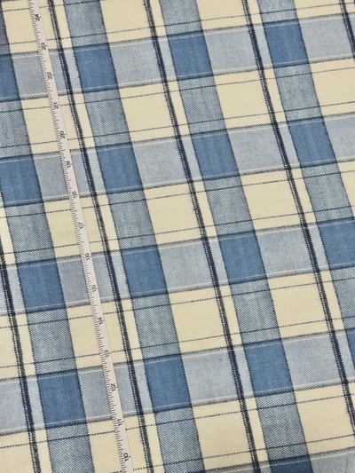 Blue and white twill flannel plaid yarn-dyed fabric, with thin navy lines crossing broad bands.