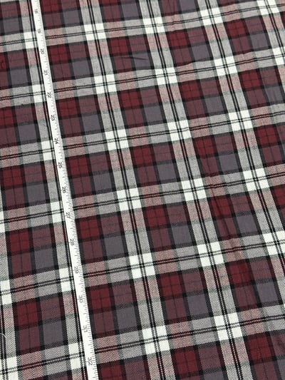 Maroon, grey and white herringbone plaid yarn-dyed fabric.