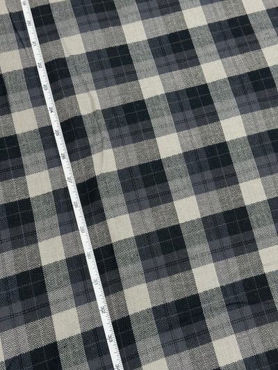 Black and grey herringbone plaid yarn-dyed fabric.