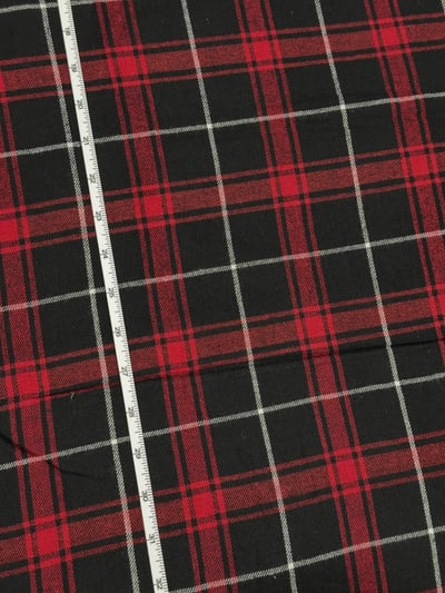 Black, red and white twill flannel plaid yarn-dyed fabric, with thin white lines between broad red bands.