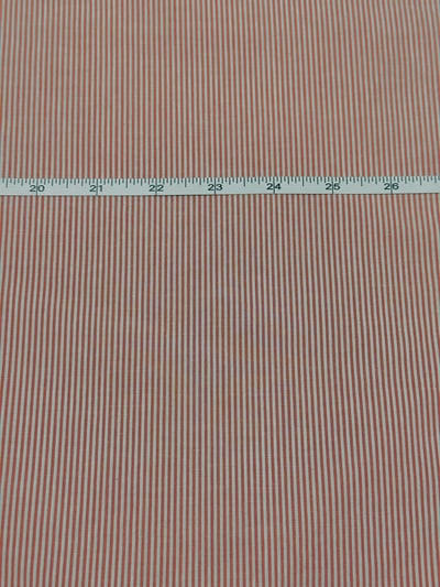 Red and white candy stripe yarn-dyed fabric.