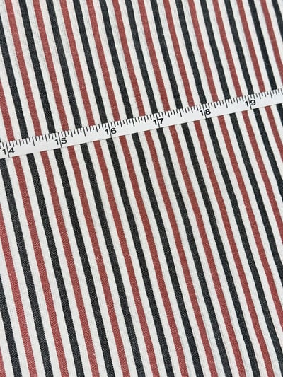 Black, red and white multi stripe yarn-dyed fabric, with evenly spaced narrow stripes.